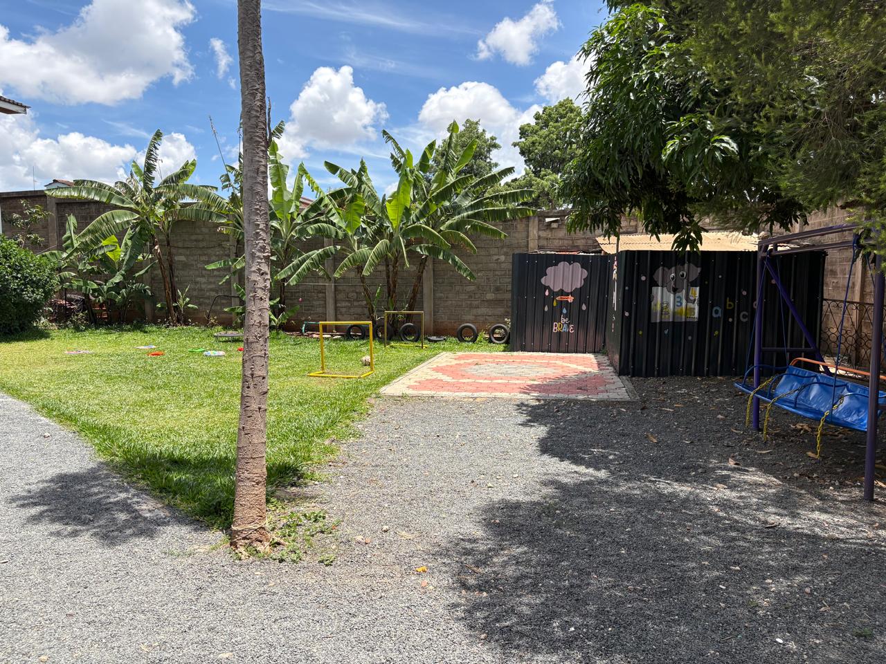 School playground with swings and play area